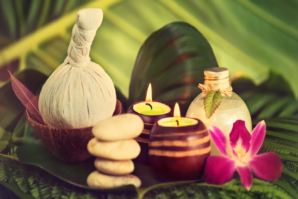 Candles with flowers on leaves